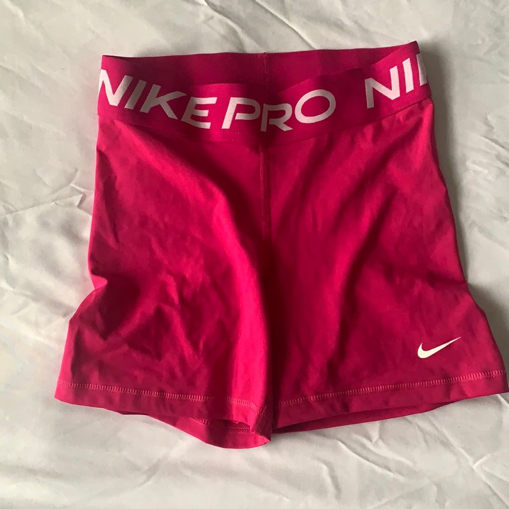 Pink Nike pro compression shorts